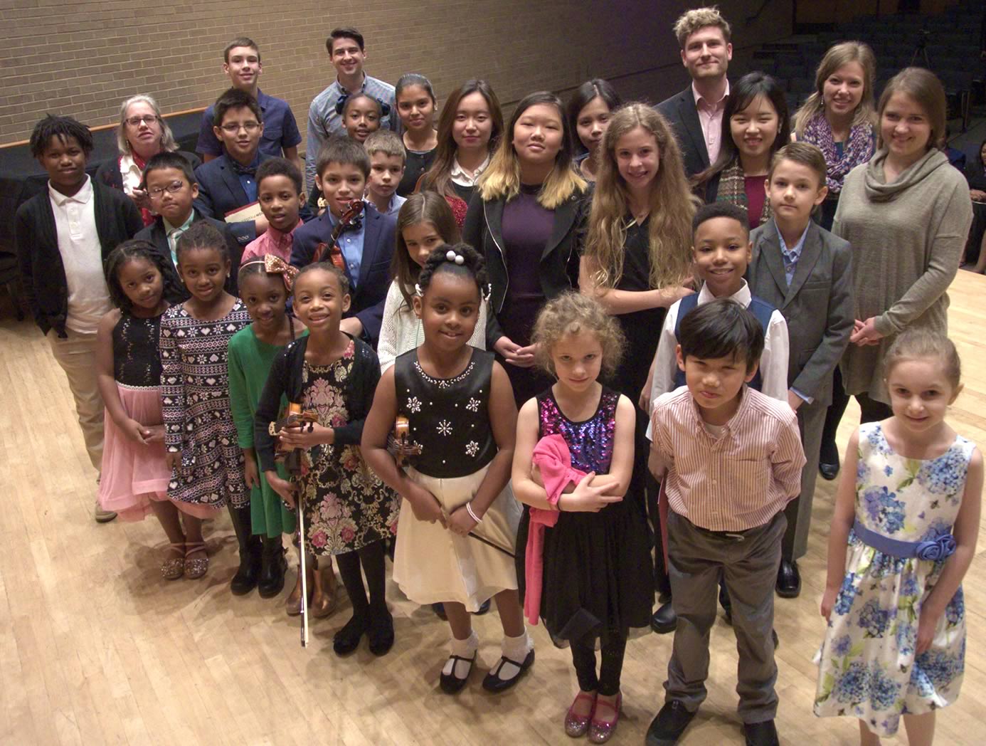 Group photo of young recital students and their teachers