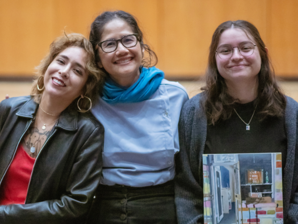 CAMP artists and their mentor smiling for a photo