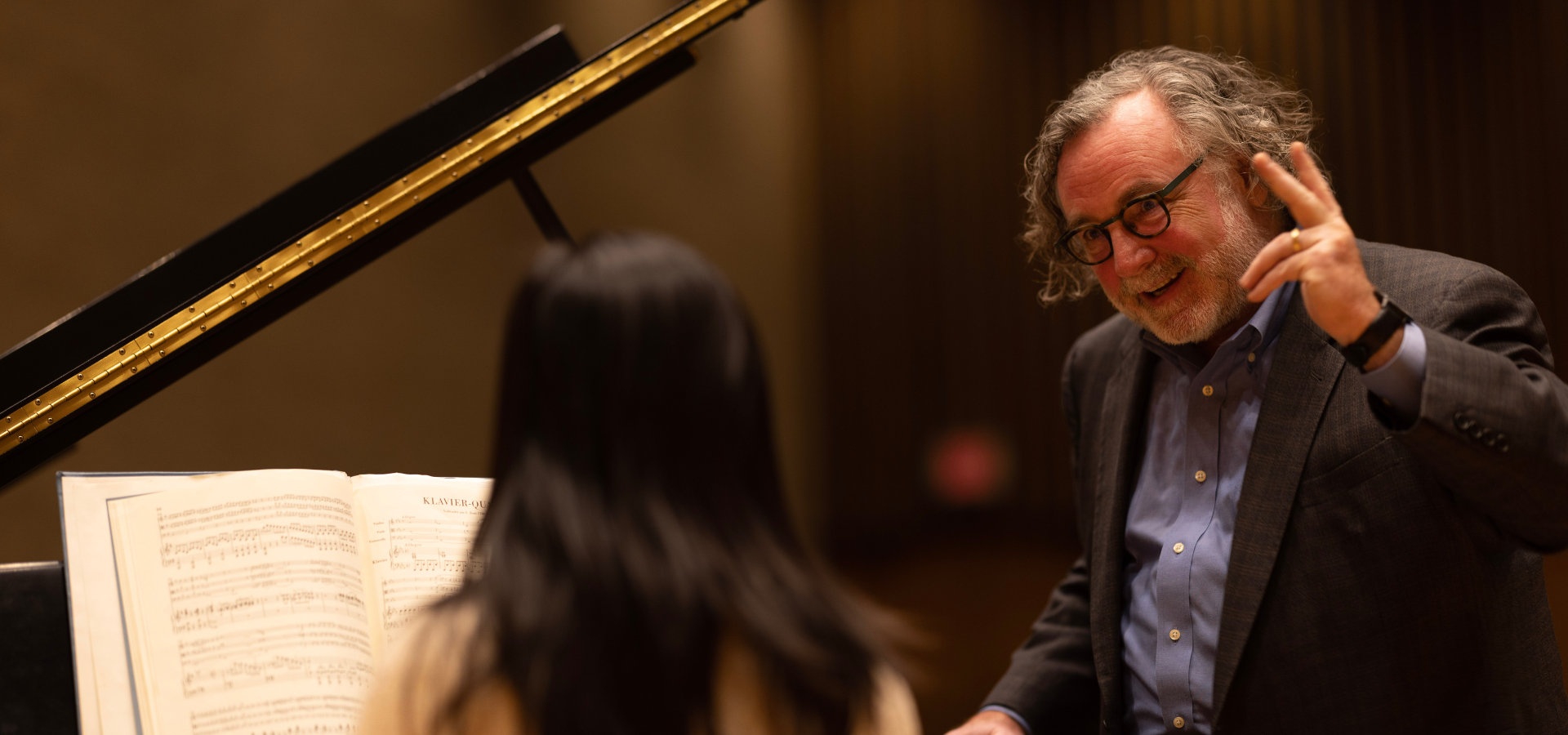 Professor Timothy Hester smiling and teaching a private lesson