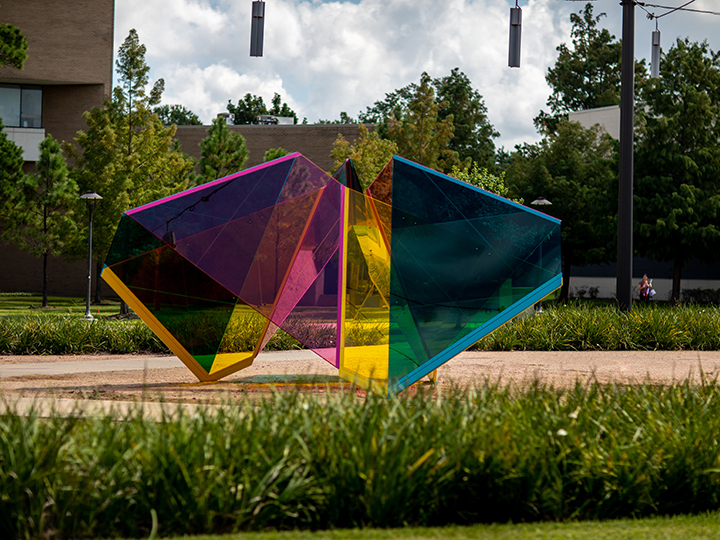 Mobius Houston from a distance with foliage in the foreground