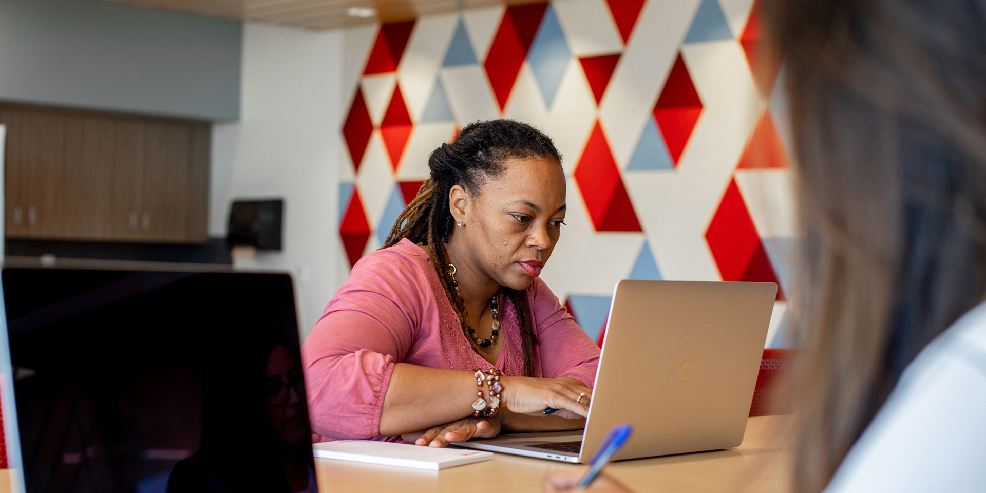 Woman sitting at a laptop