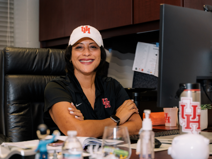 Image of Natalie Sumrow smiling at her desk.
