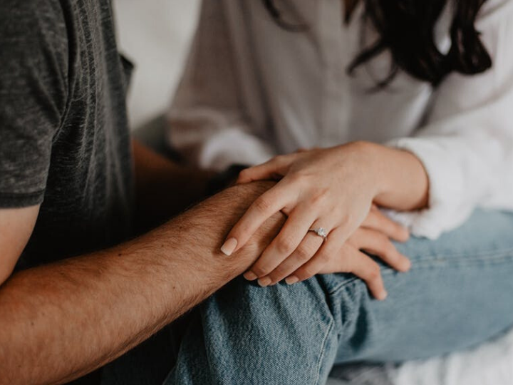 couple with hands on knees couple with hands on knees