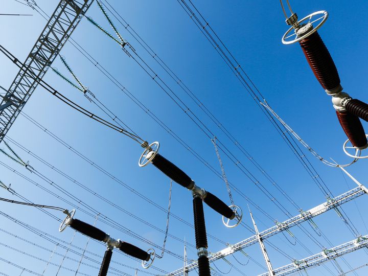 electrical lines and equipment against a blue sky