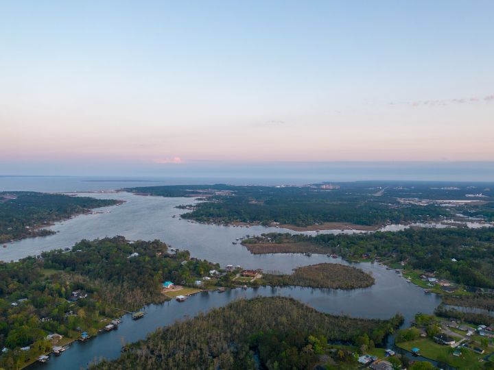 houses tucked into vegetation and waterways of the U.S. Gulf Coast