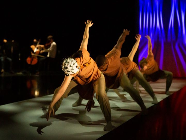 Dancers wearing brain caps