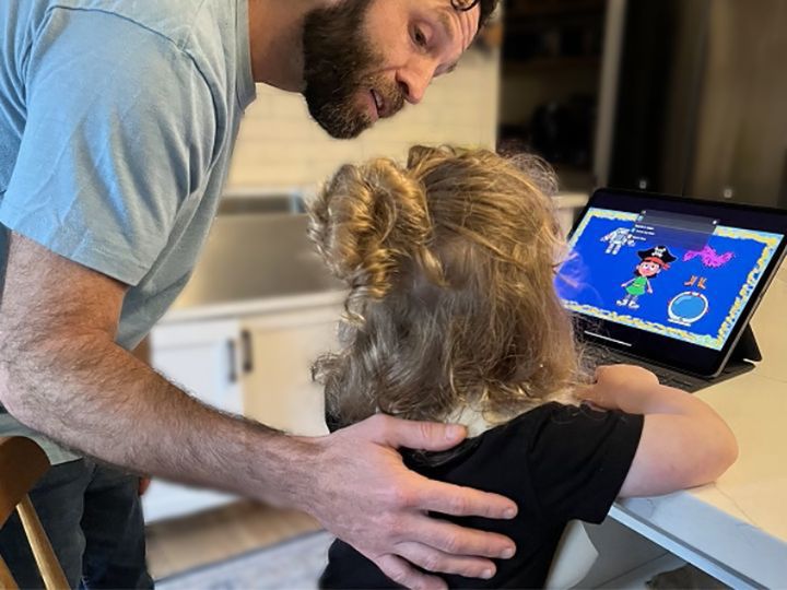 Caregiver and toddler with iPad Caregiver and toddler with iPad