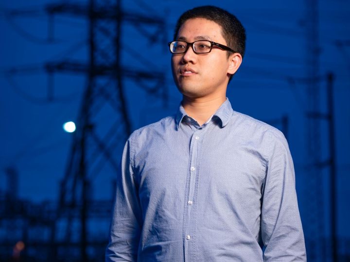 xingpeng li, assistant professor at the University of Houston, with a backdrop of electrical power systems. xingpeng li, assistant professor at the University of Houston, with a backdrop of electrical power systems.