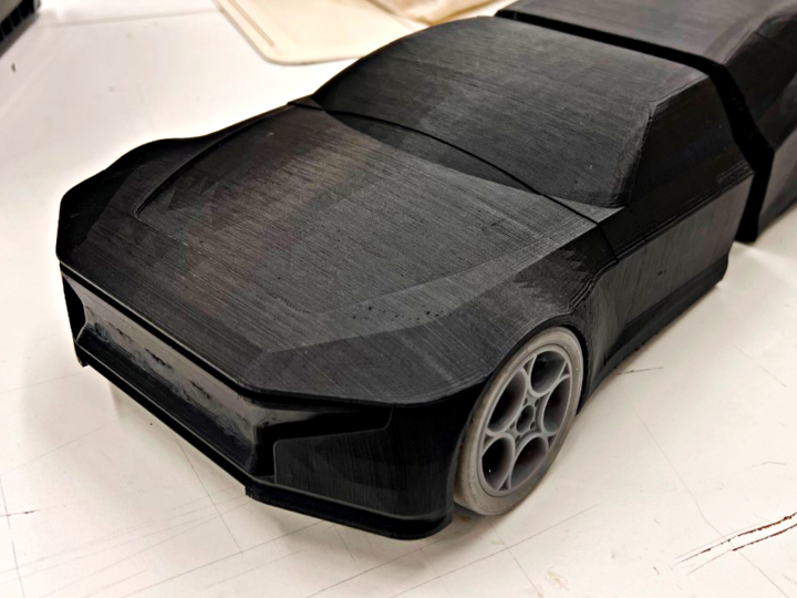 Black 3D printed version of an electrical vehicle model Black 3D printed version of an electrical vehicle model