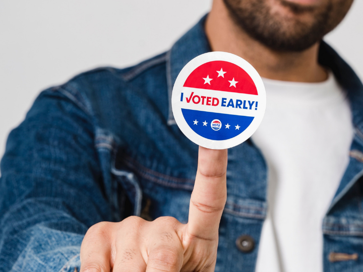 Photo of young man with sticker saying I voted early Photo of young man with sticker saying I voted early