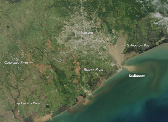 NASA image of the Houston metro area, with brown sediment all throughout the waterways