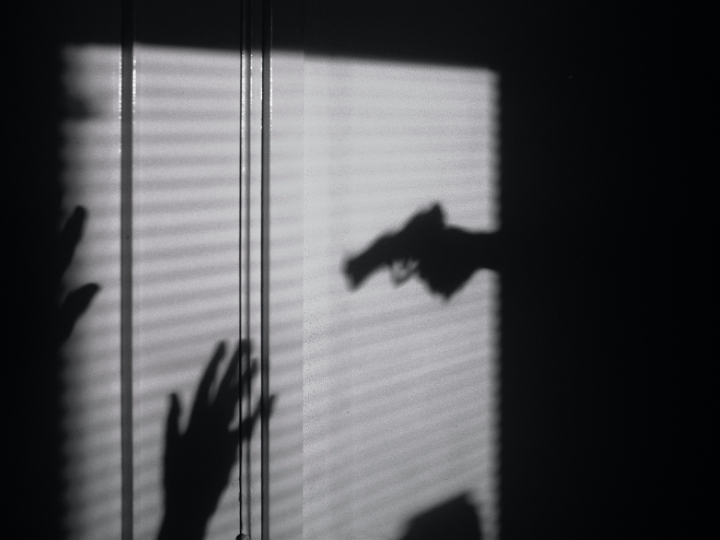 Shadow of gun pointed at someone Shadow of gun pointed at someone