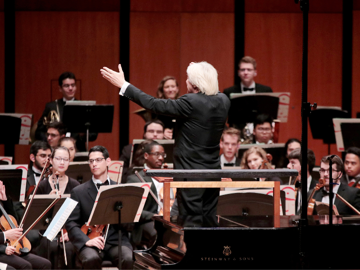 Conductor leads orchestra Conductor leads orchestra