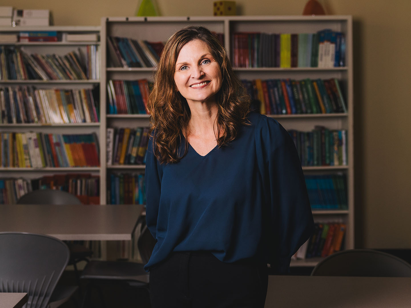 Carrie Cutler, clinical assistant professor and researcher in the College of Education, poses for a portrait inside her office at Farish Hall.