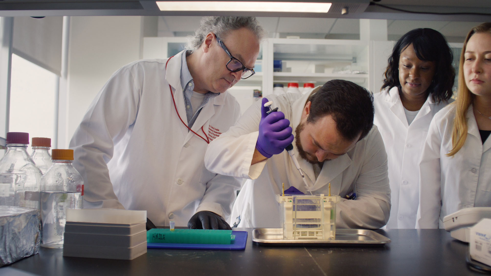 UH researcher and students in bio med lab