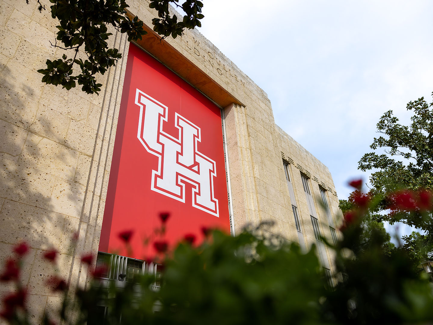 Red UH Banner on the Cullen Performance Hall.