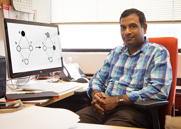 Gopal Pandurangan, associate professor of computer science, works on algorithms that increase the speed of forecasting the spread of disease.