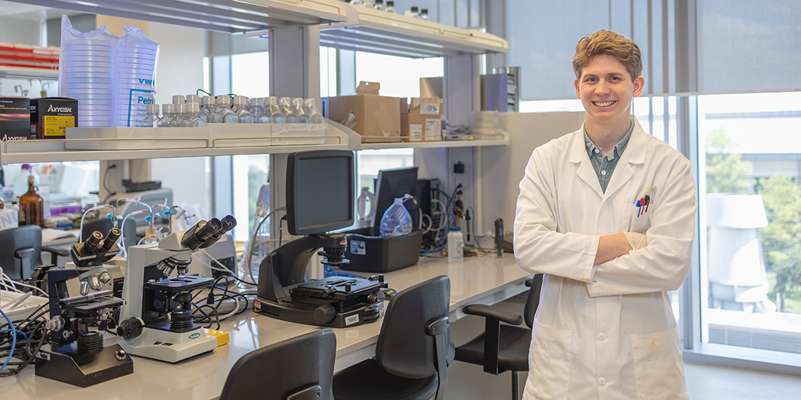 Picture of Cold Hudson smiling in a lab