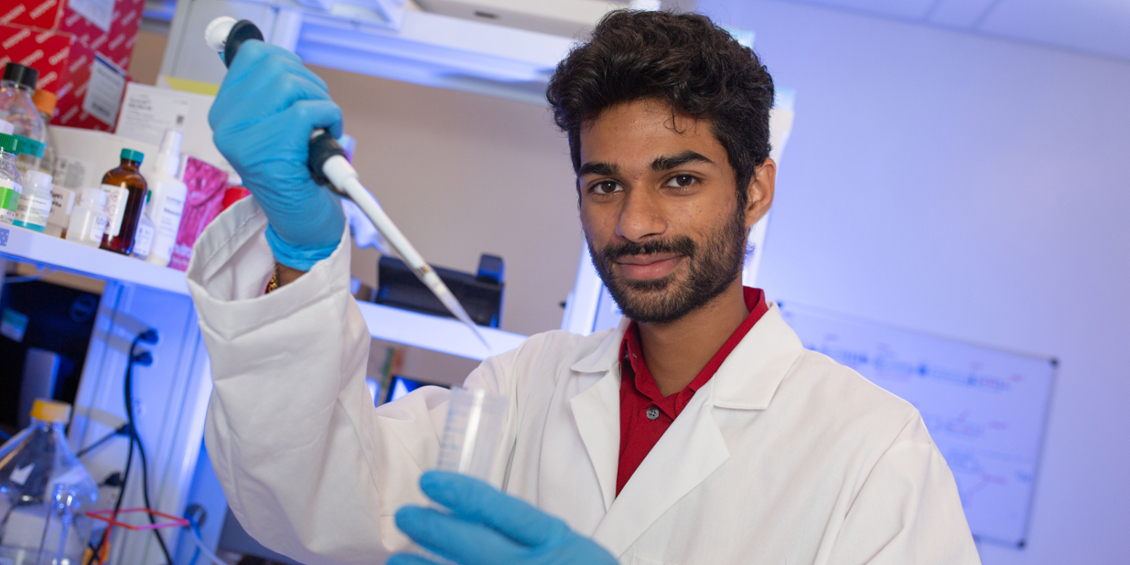 Student pipetting a sample