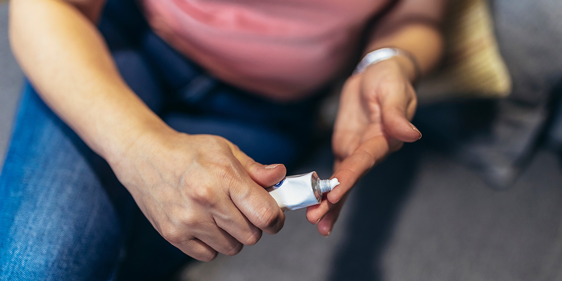 adult holding hormone replacement therapy cream