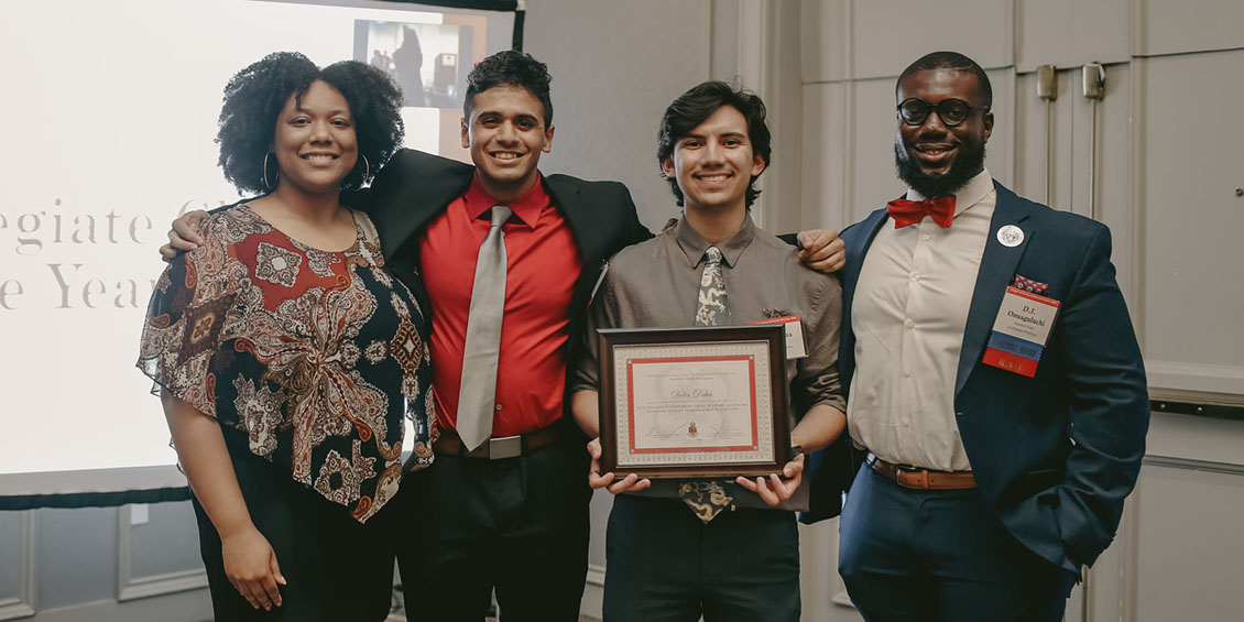 student and officers with award