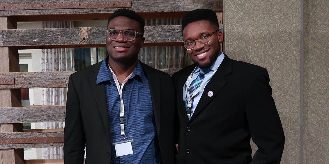 Kappa Psi members Emetu Umah and Michael Crichlow