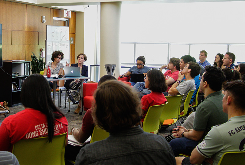 researchers in a seminar at the Digital Research Commons