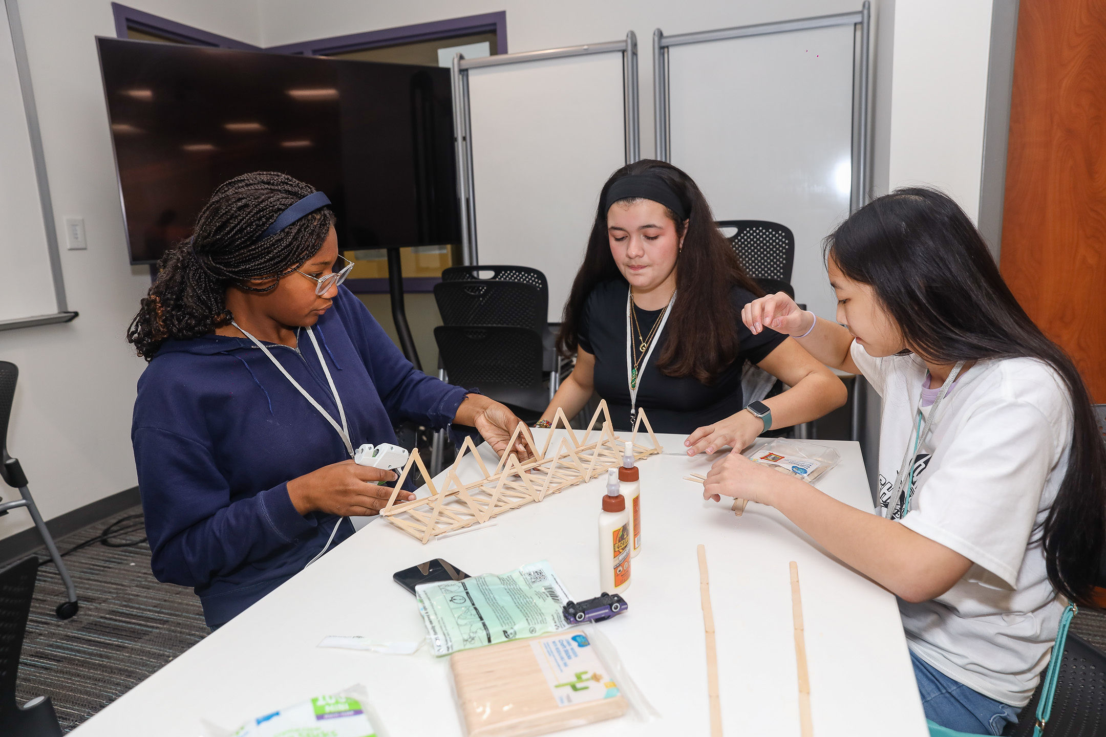 High school students participating in the Fall Fresh Start bridge building session.