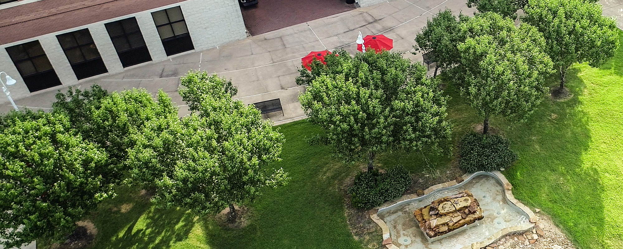 Overhead view of the fountain and trees behind the Albert and Mamie George Building