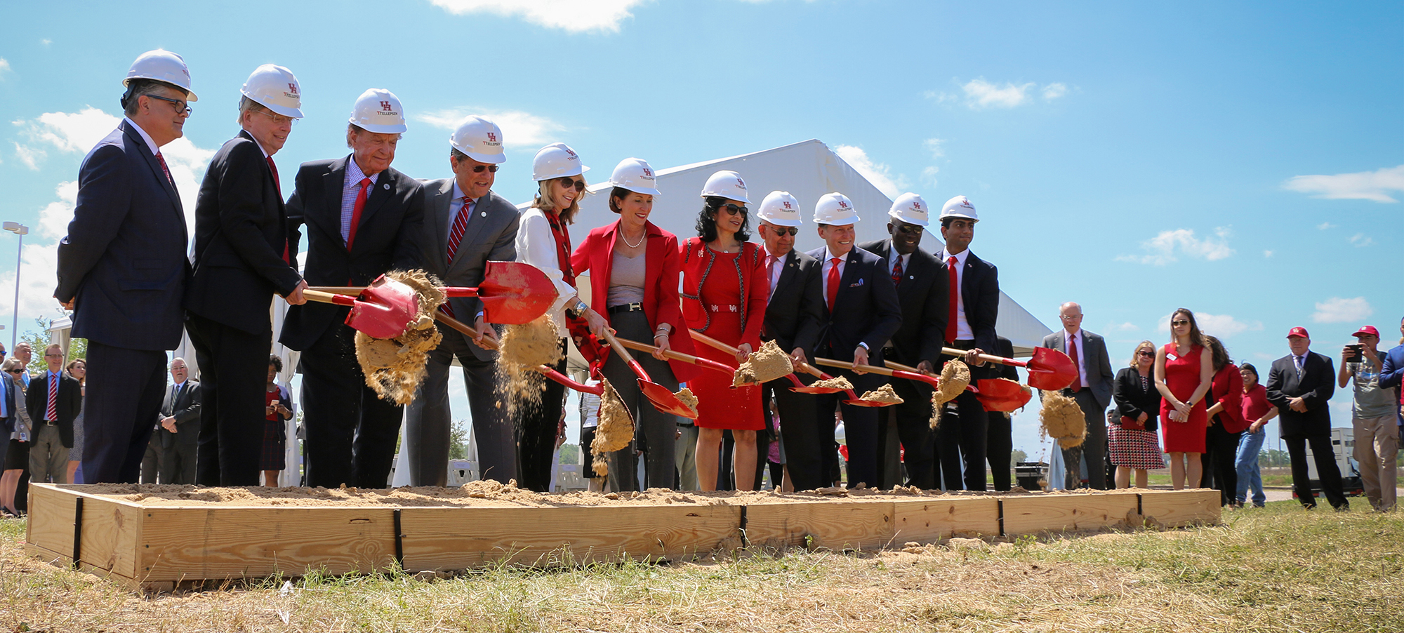 Group of people with shovels at a groundbreaking ceremony