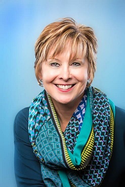 Portrait of a woman wearing a blue plaid scarf