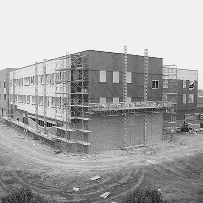 A building under construction with scafolding surrounding it