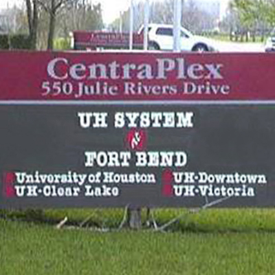 Photograph of a roadside sign that says "UH System at Fort Bend"