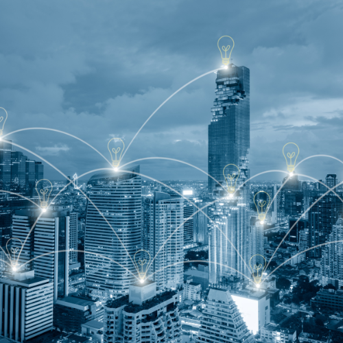 Illustration of a smart city network featuring a light bulb symbolizing innovation and interconnected network connections.